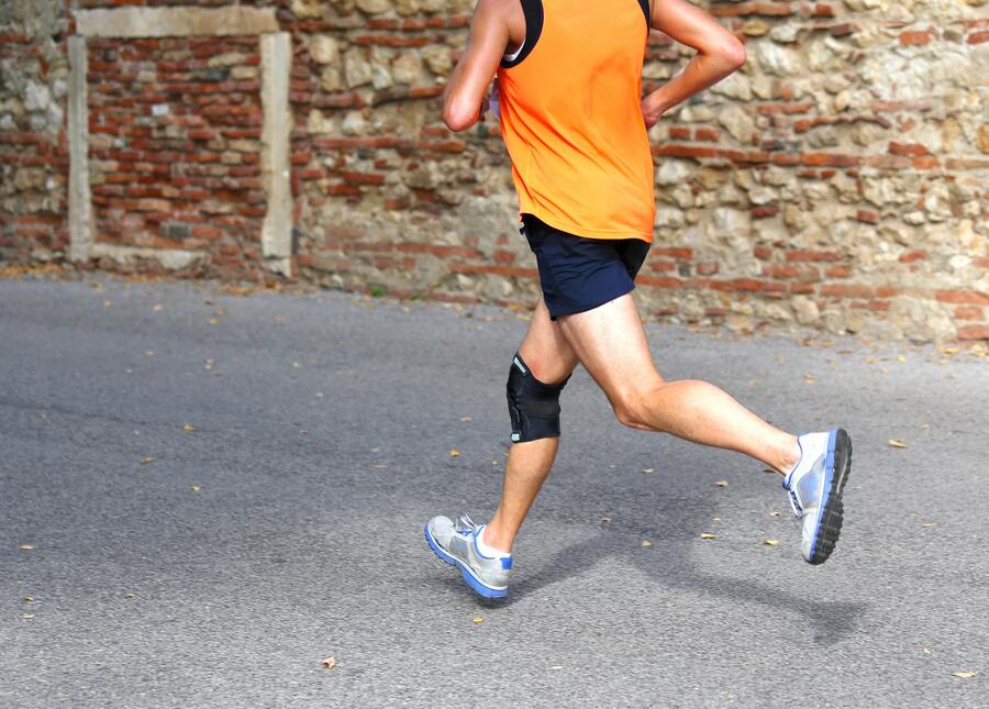 Runner with knee brace